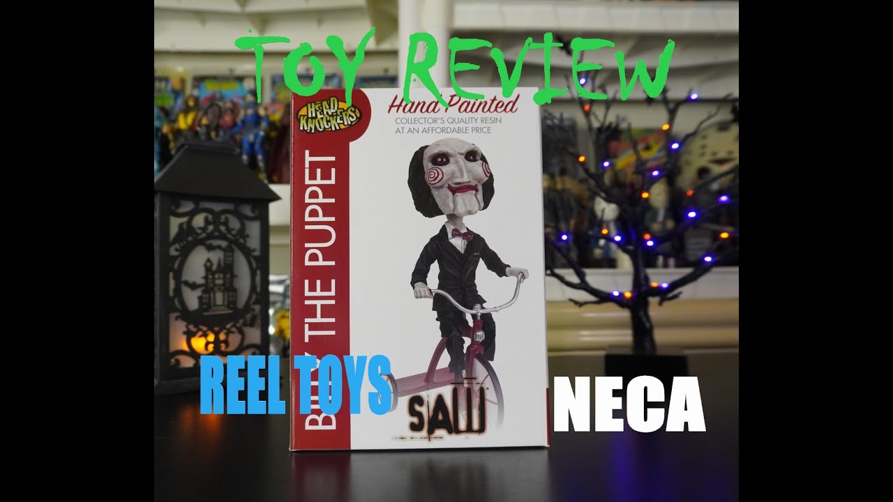 SAW BILLY THE PUPPET HEAD KNOCKER FROM NECA AND REEL TOYS UNBOXING